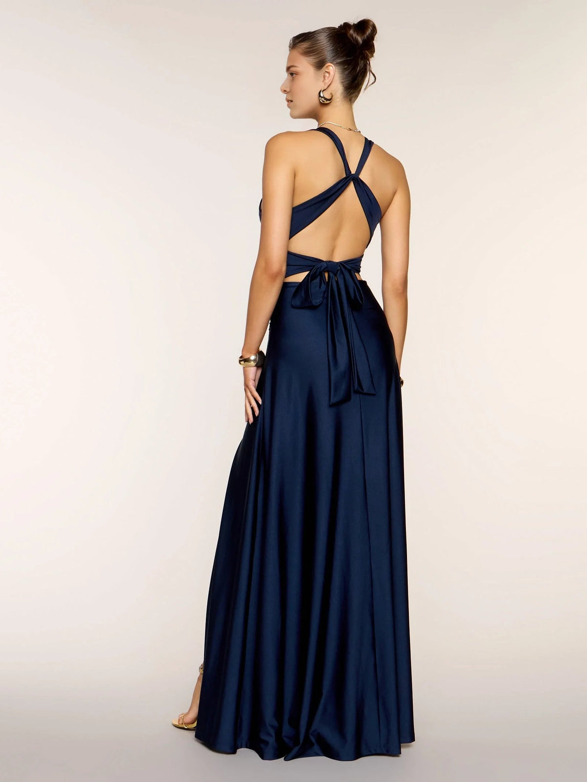Navy satin A-line maxi dress with back crisscross straps and bow tie detail