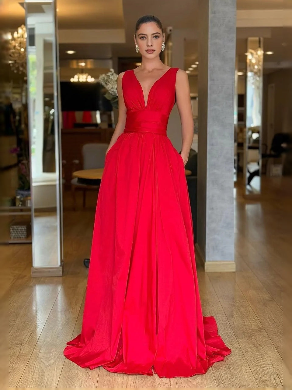 Red V-neck A-line prom dress with ruched pleats, sleeveless floor-length design