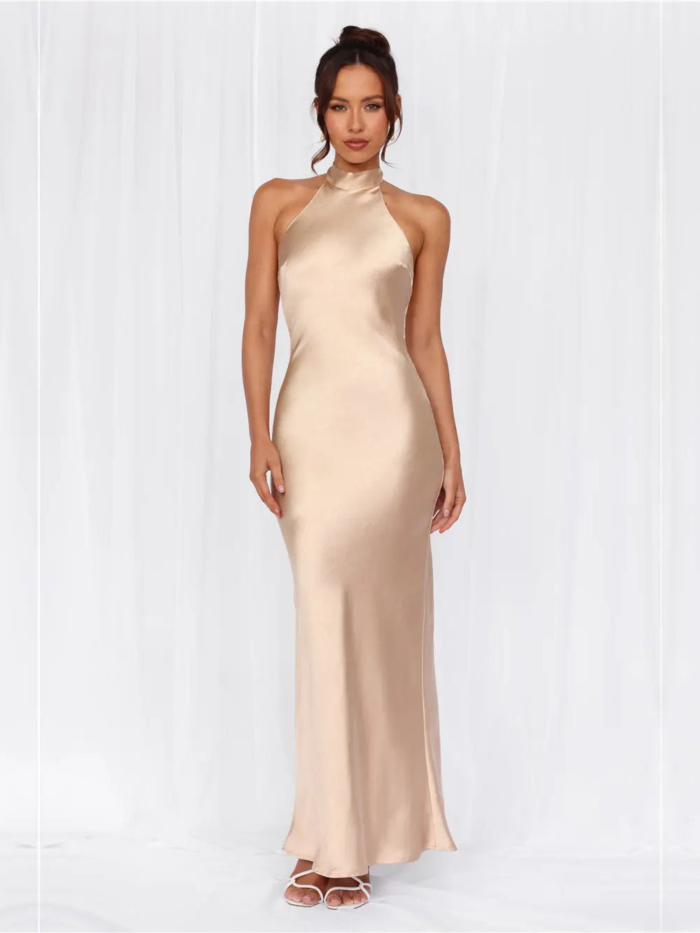 Champagne sheath maxi formal dress with halter neckline, full-length front view