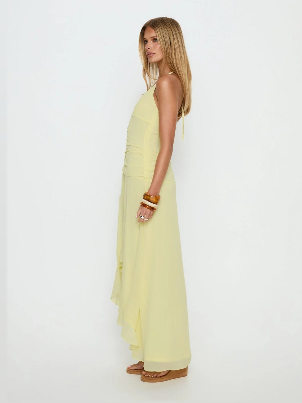 Yellow formal dress with asymmetrical silhouette and maxi length
