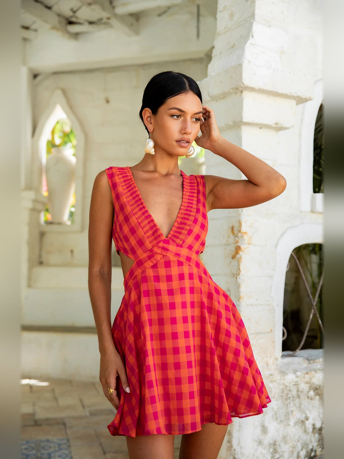Pink and red gingham mini dress, sleeveless V-neck, fitted waist, flared skirt