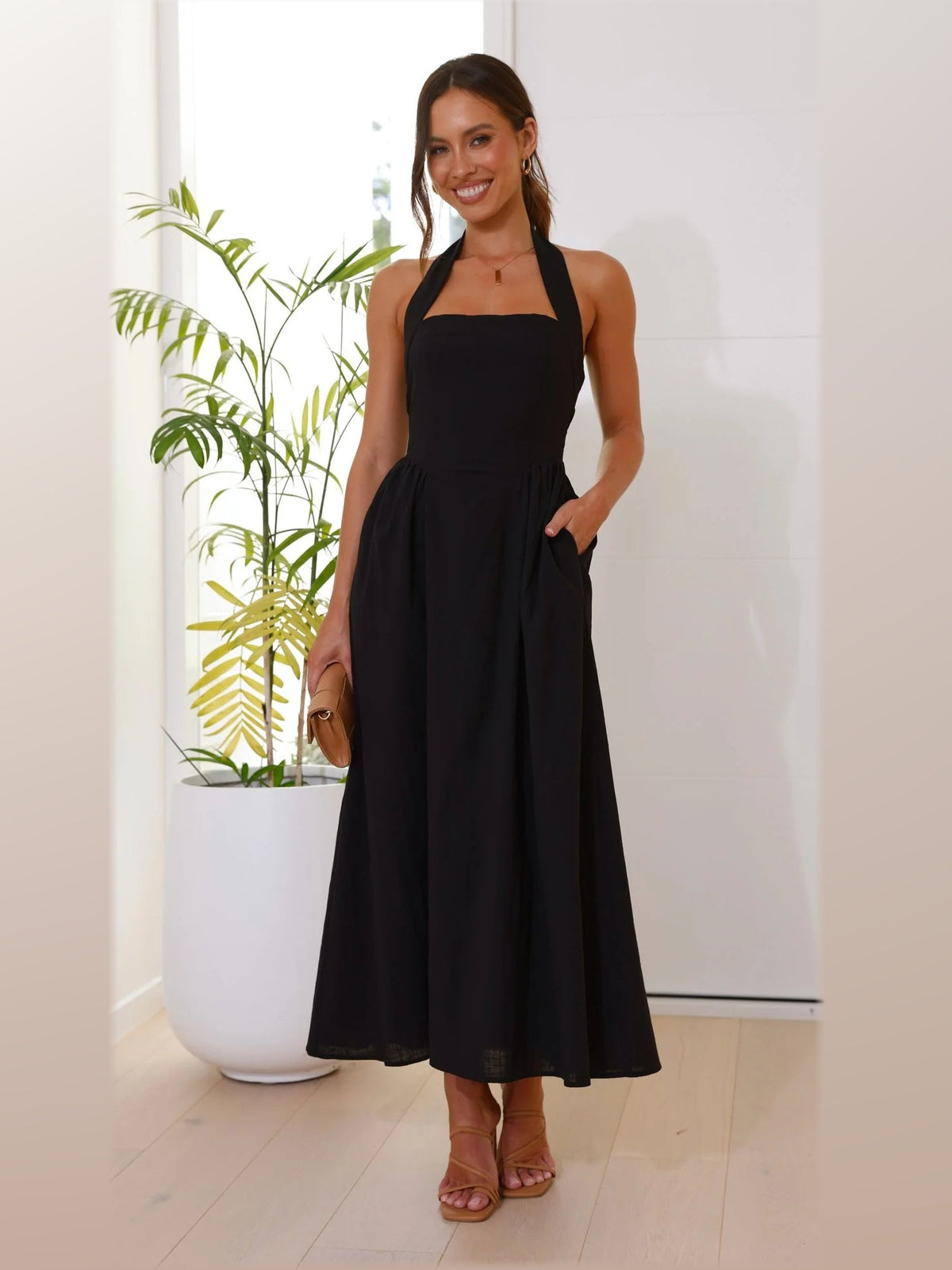 Black midi formal dress, front full-length view showing the neckline