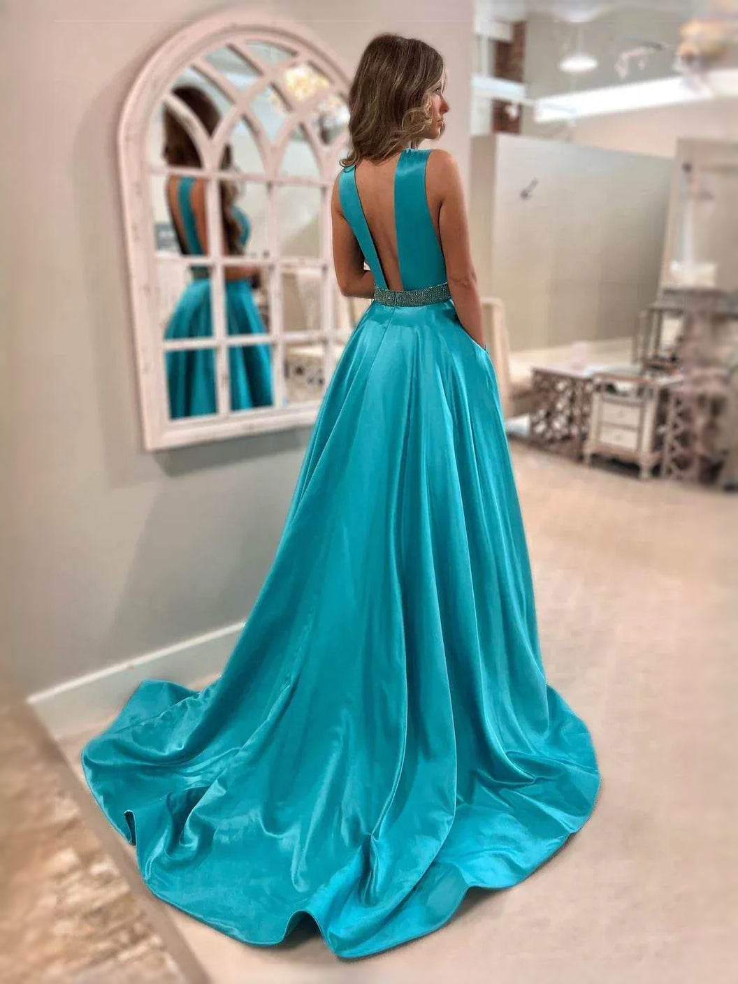 Turquoise satin maxi dress with draped open back and flowing A-line skirt