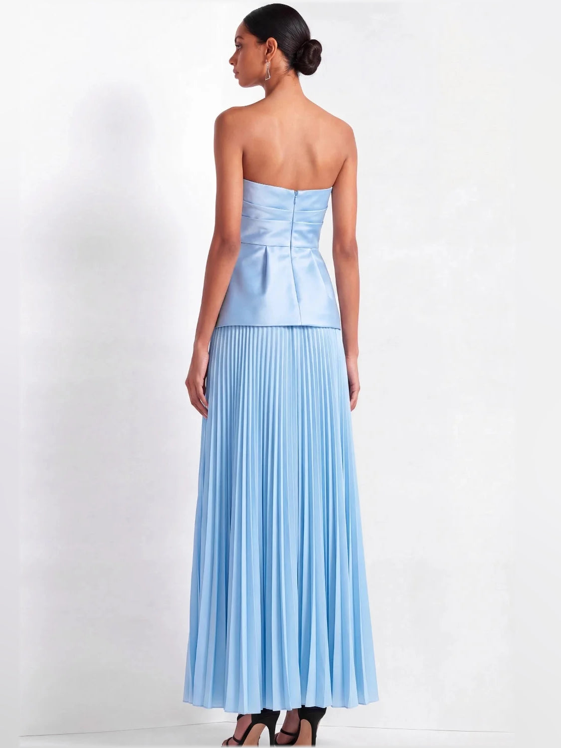 Back view of light blue strapless satin column maxi dress with pleated skirt