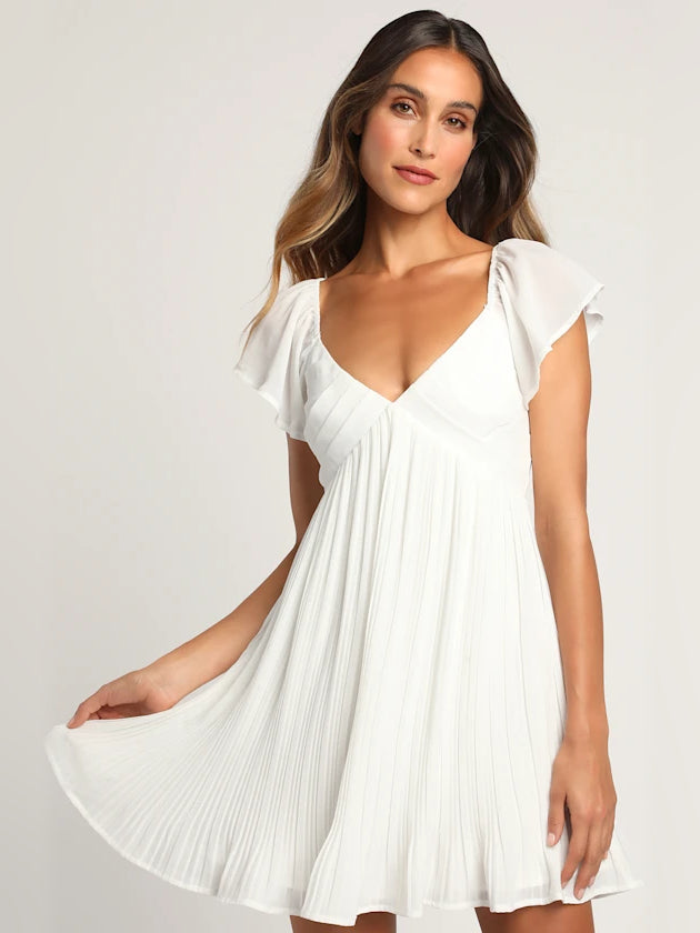 White pleated mini dress with V-neck and flutter sleeves, gathered bodice