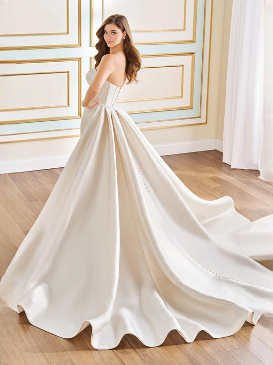 Ivory strapless satin A-line wedding dress with ruched draped bodice and flowing skirt