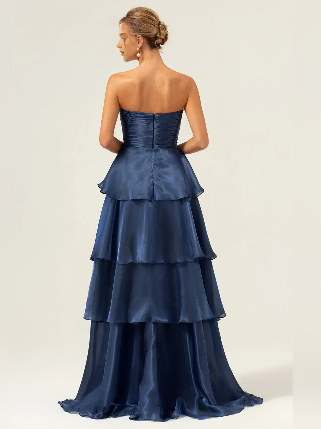 Dark navy strapless prom dress with ruched bodice and tiered ruffle A-line skirt, floor length