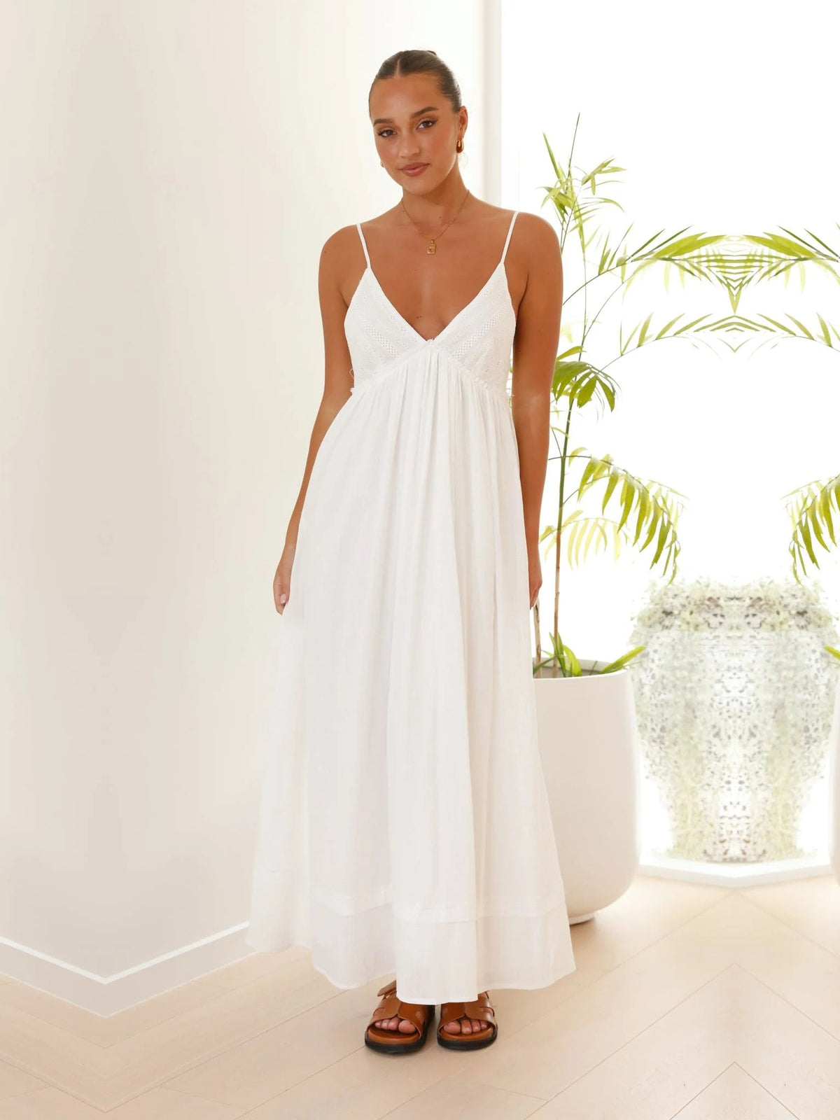 White a-line maxi formal dress with V-neckline, full-length front view