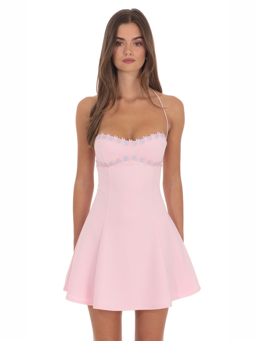 Pink fit-and-flare mini homecoming dress with spaghetti straps and ruffled bust trim