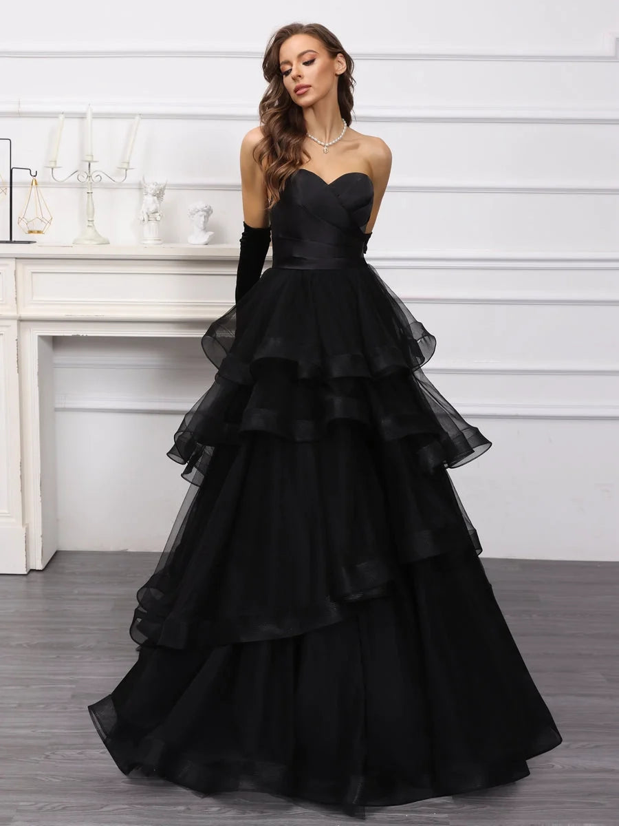 Black sweetheart A-line satin wedding dress with tiered ruffle skirt and fitted strapless bodice