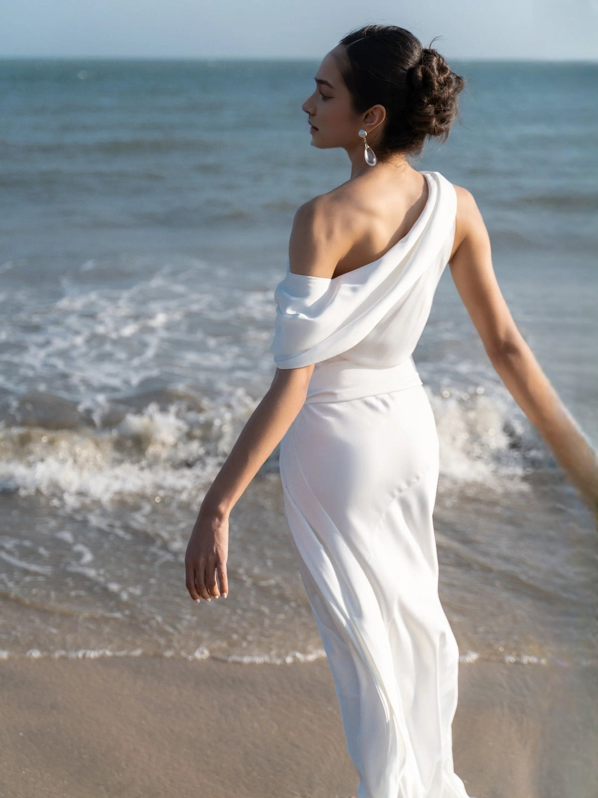 Ivory satin one-shoulder draped sheath wedding dress, floor-length, fitted waist