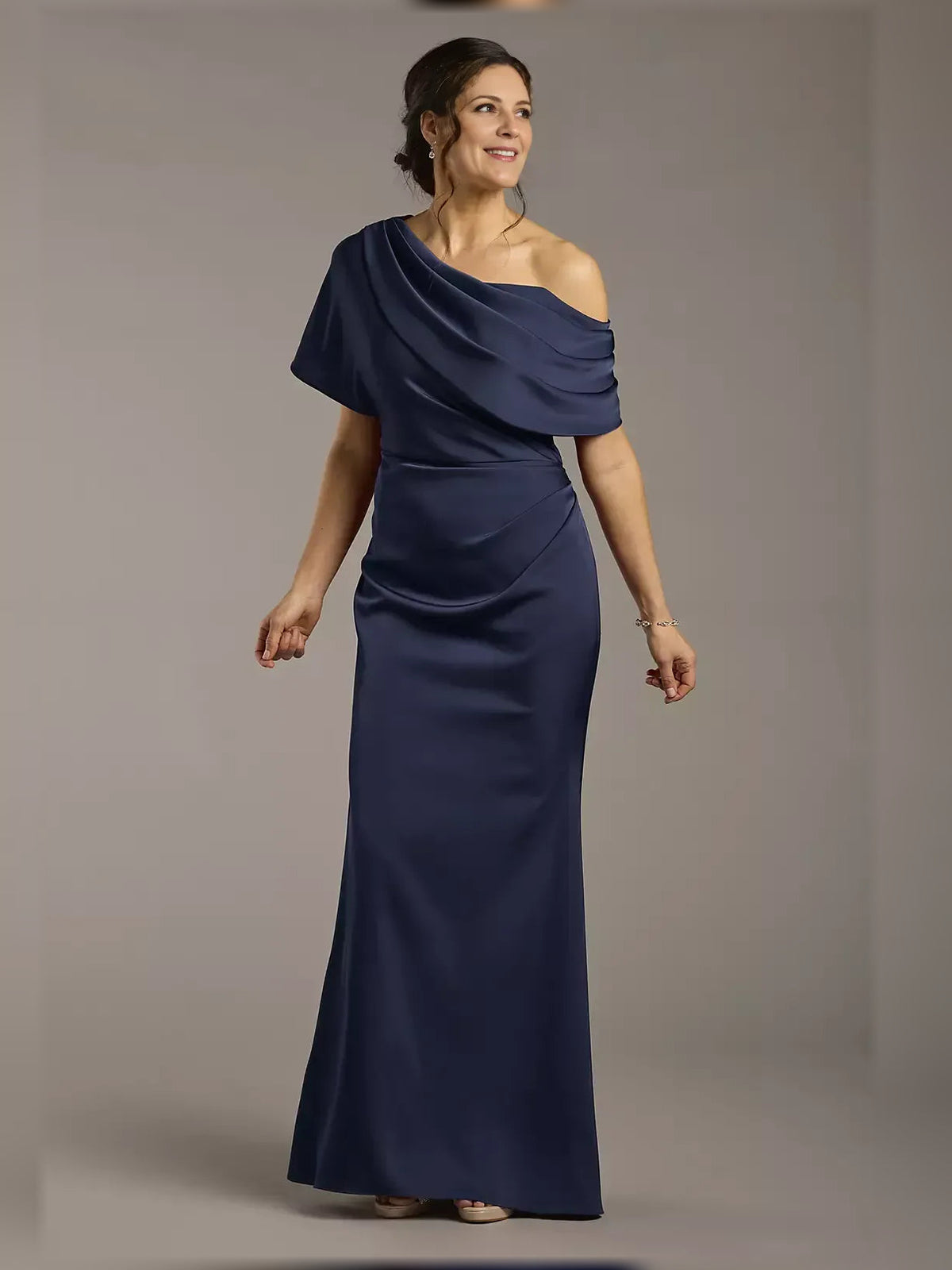Navy one-shoulder satin sheath dress with draped ruffle detail, floor-length