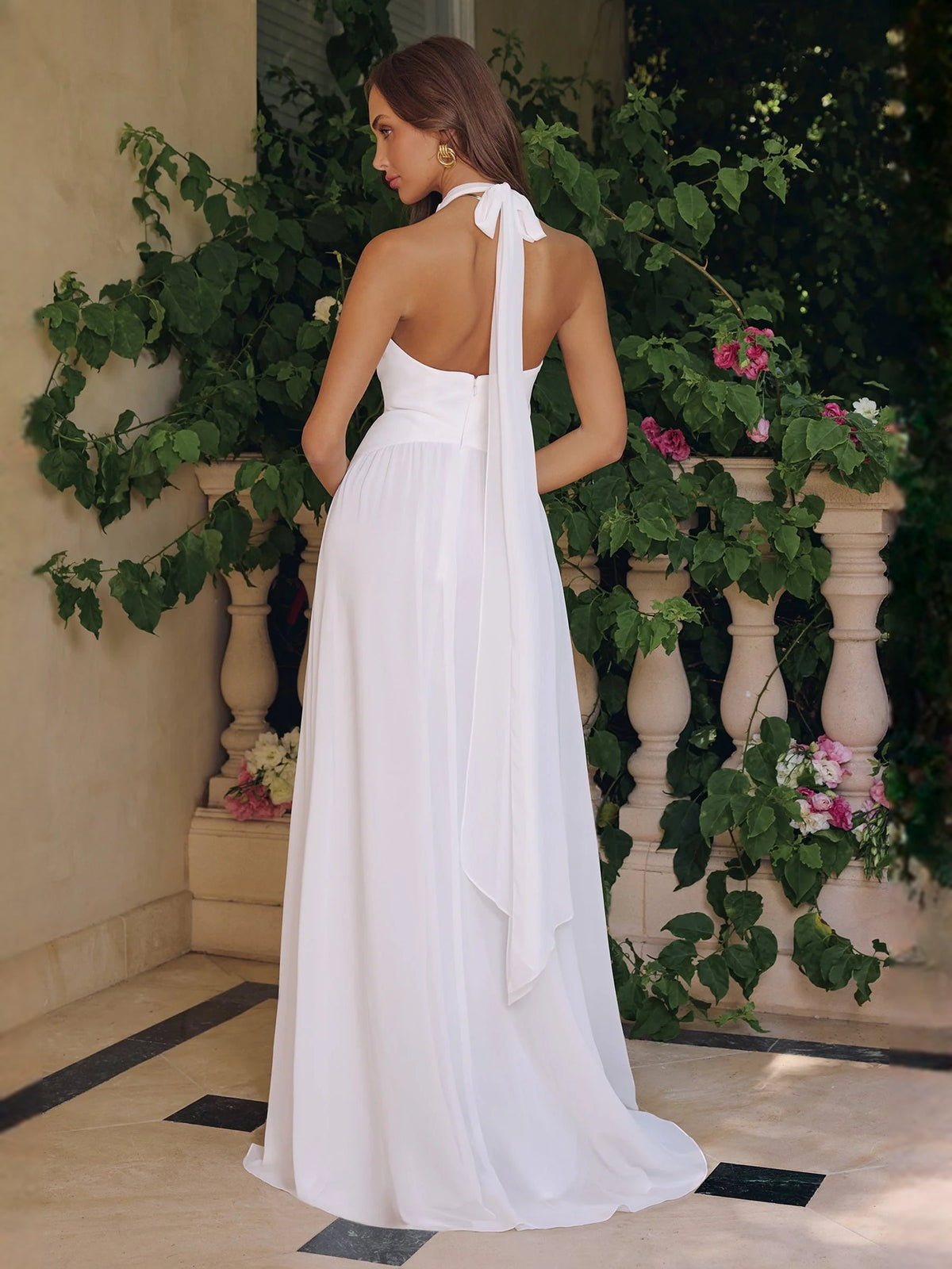 Ivory chiffon wedding dress with V-neck, A-line skirt, ruched waist, and back bow