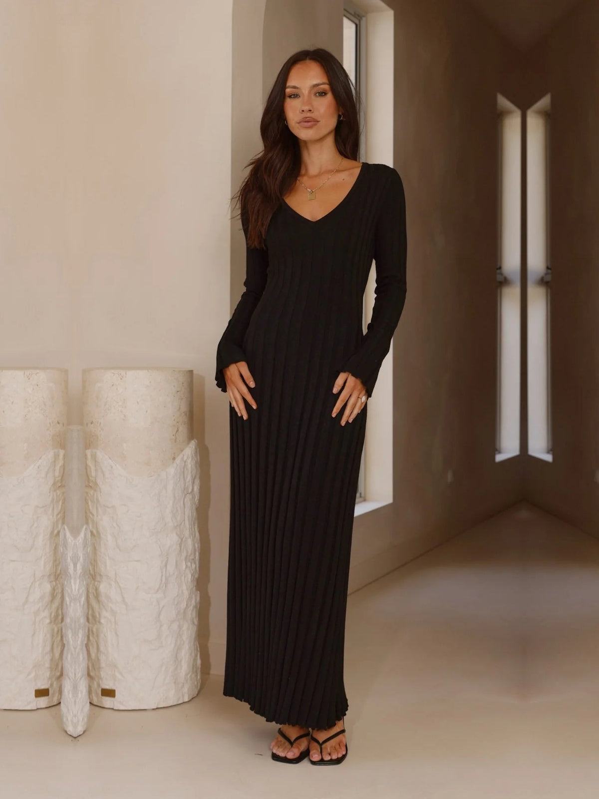 Black sheath maxi formal dress with V-neckline, full-length front view