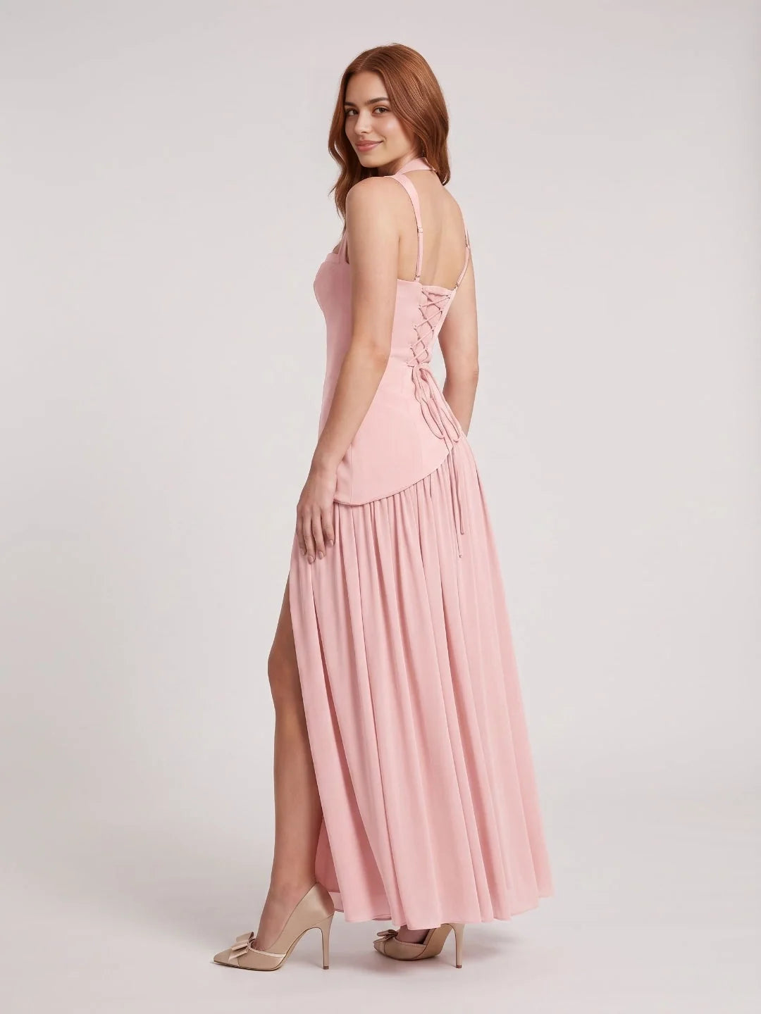 Pink chiffon bridesmaid dress with halter neckline, corset bodice, and side slit skirt