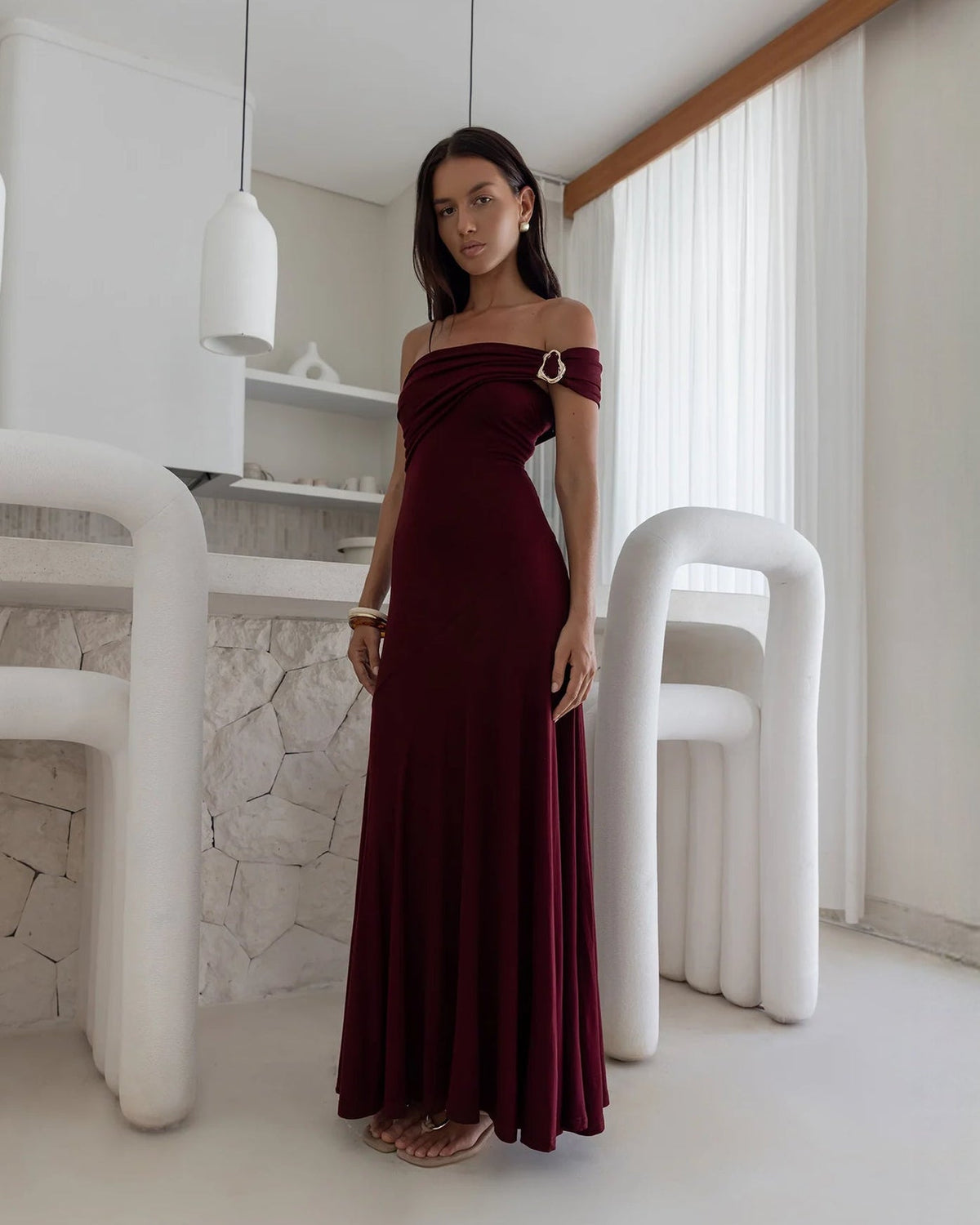 Wine red off-shoulder A-line maxi bridesmaid dress with draped neckline and ring detail