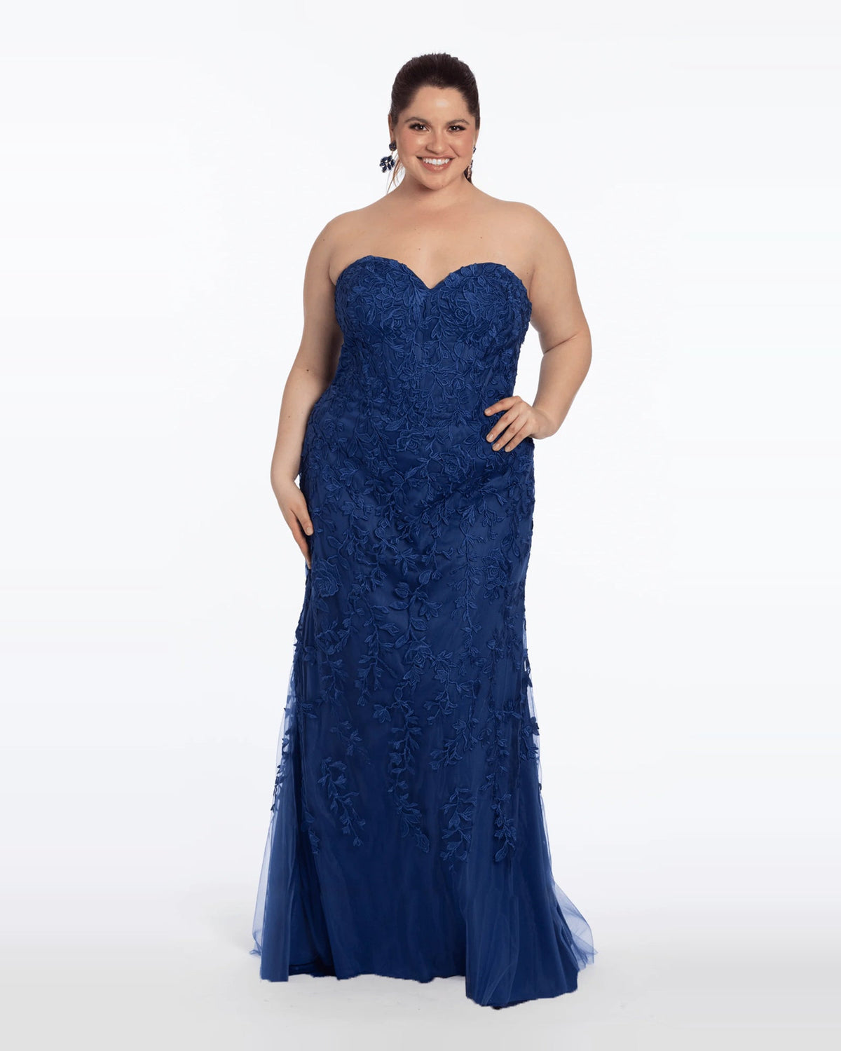 Navy strapless corset-style maxi prom dress with embroidered floral texture, column silhouette.