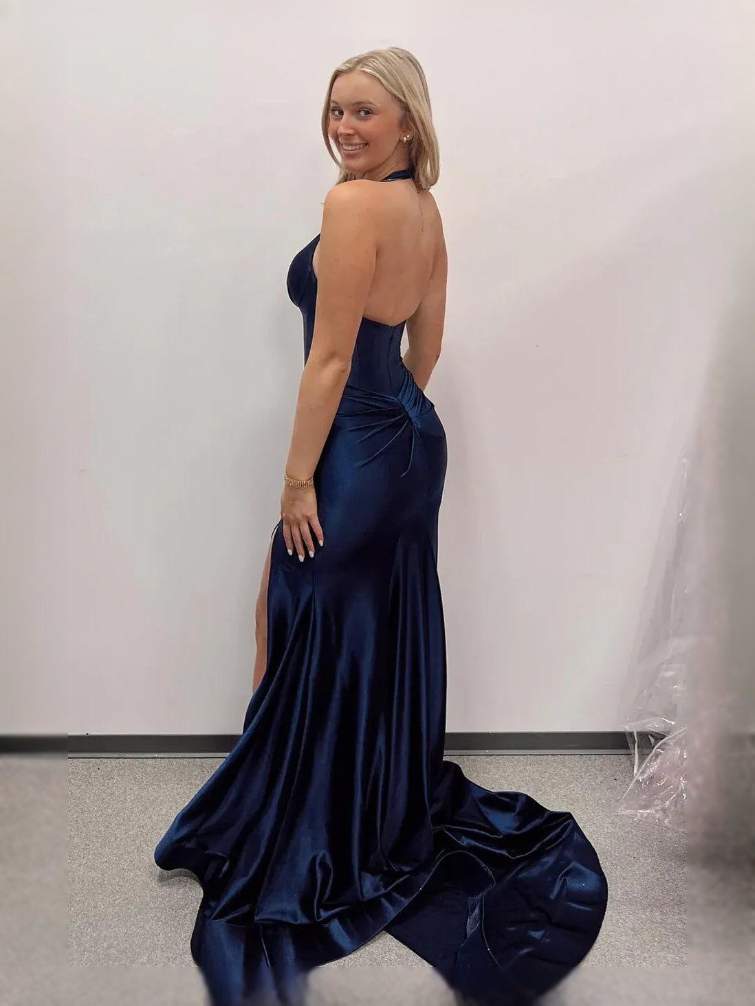 Navy satin halter mermaid prom dress with ruched bodice, open back, thigh slit