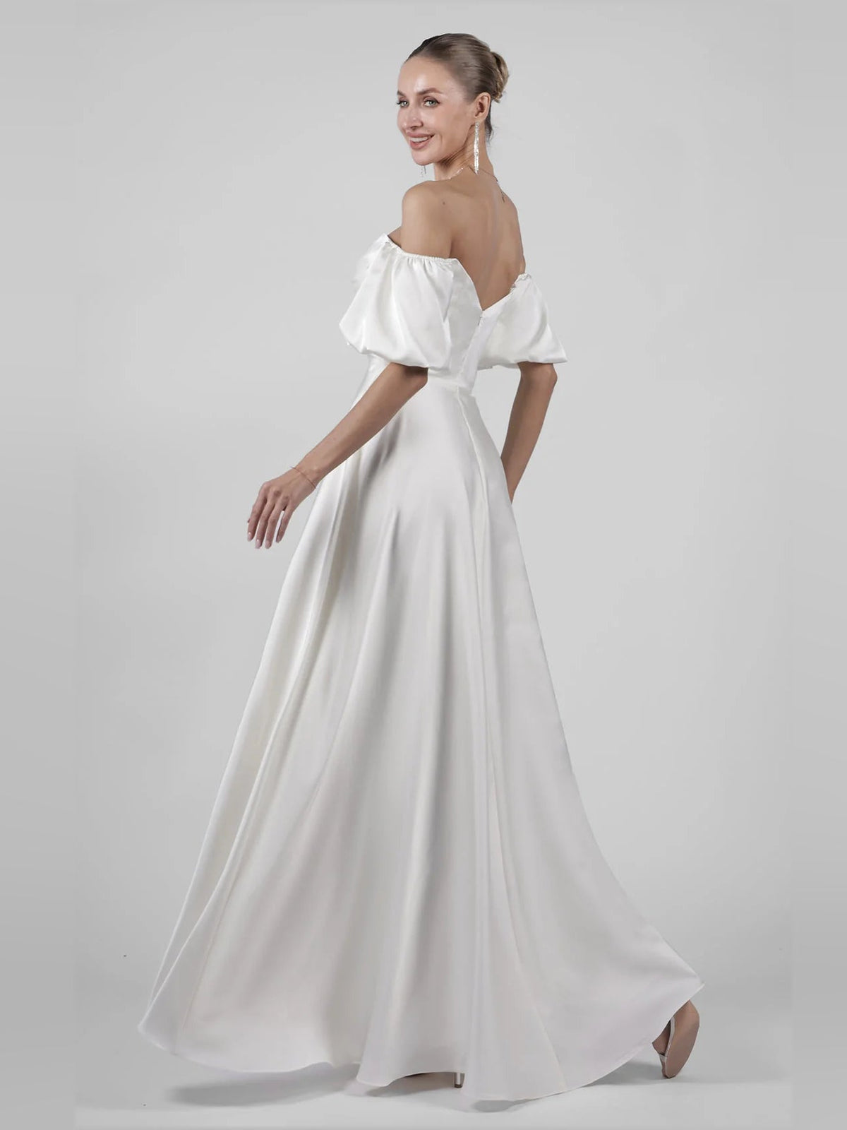 Ivory off-shoulder satin A-line maxi wedding dress with puff sleeves and sweetheart bodice