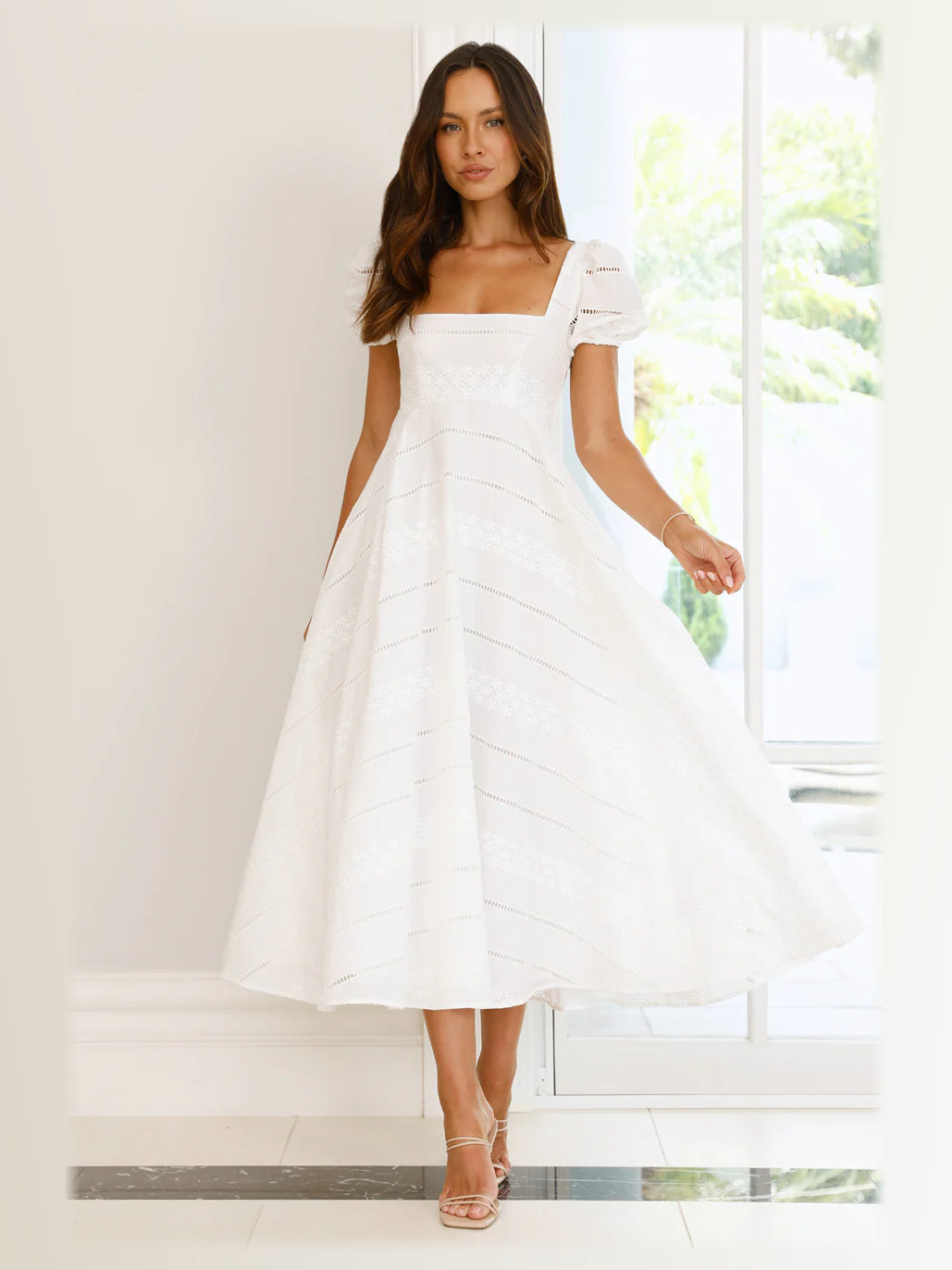 White formal dress with a-line silhouette and maxi length