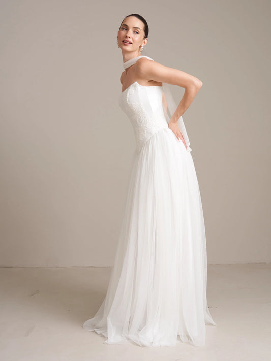 Ivory strapless satin wedding dress with draped corset and A-line tulle skirt