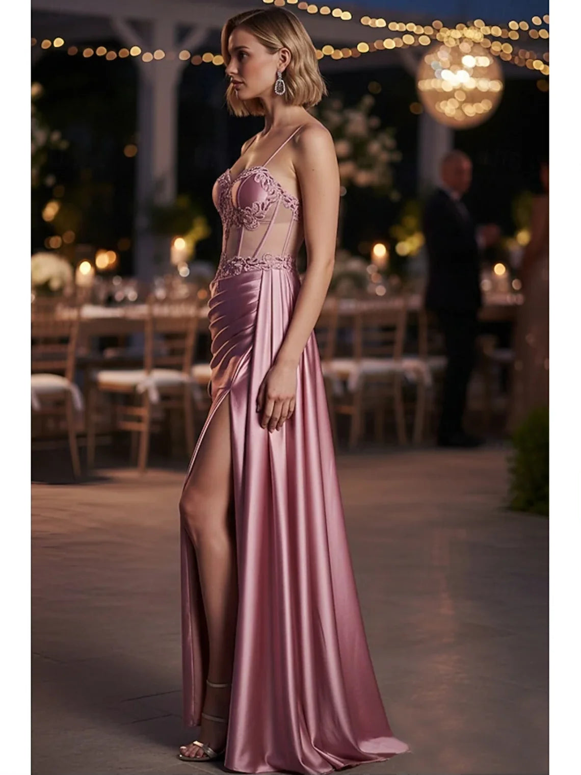 Rose gold satin prom dress with sweetheart lace bodice, ruched detailing, and front slit