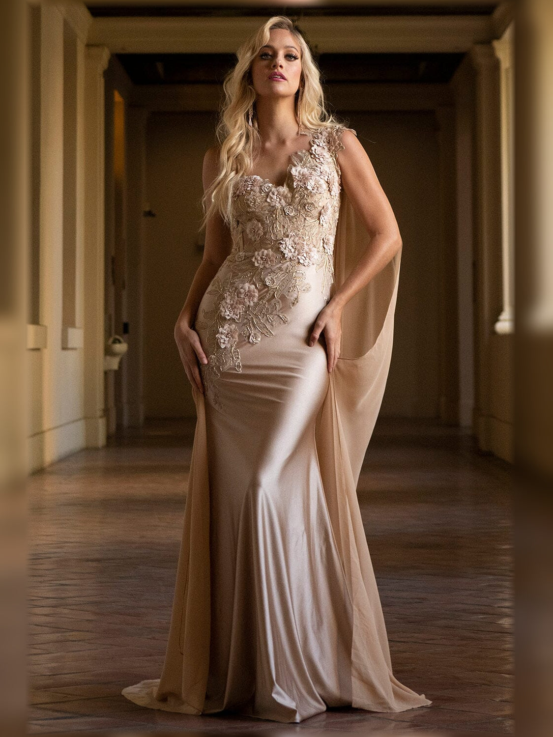 One-shoulder mermaid formal dress in champagne with floral lace appliques, floor-length.