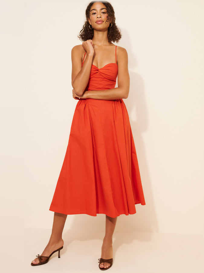 Coral red sleeveless midi formal dress with ruched bust and gathered skirt