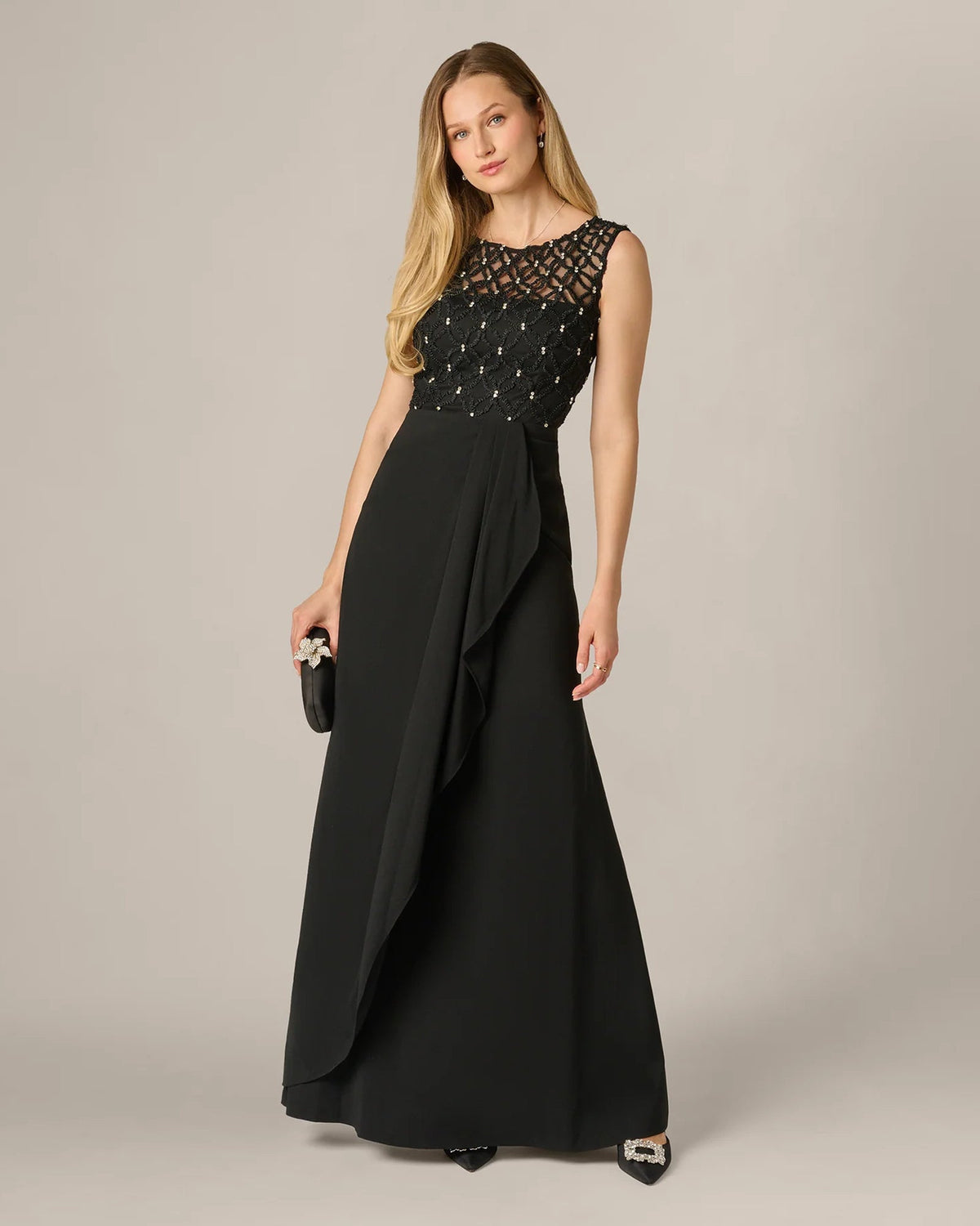 Black sleeveless maxi dress with beaded lace top and draped A-line skirt