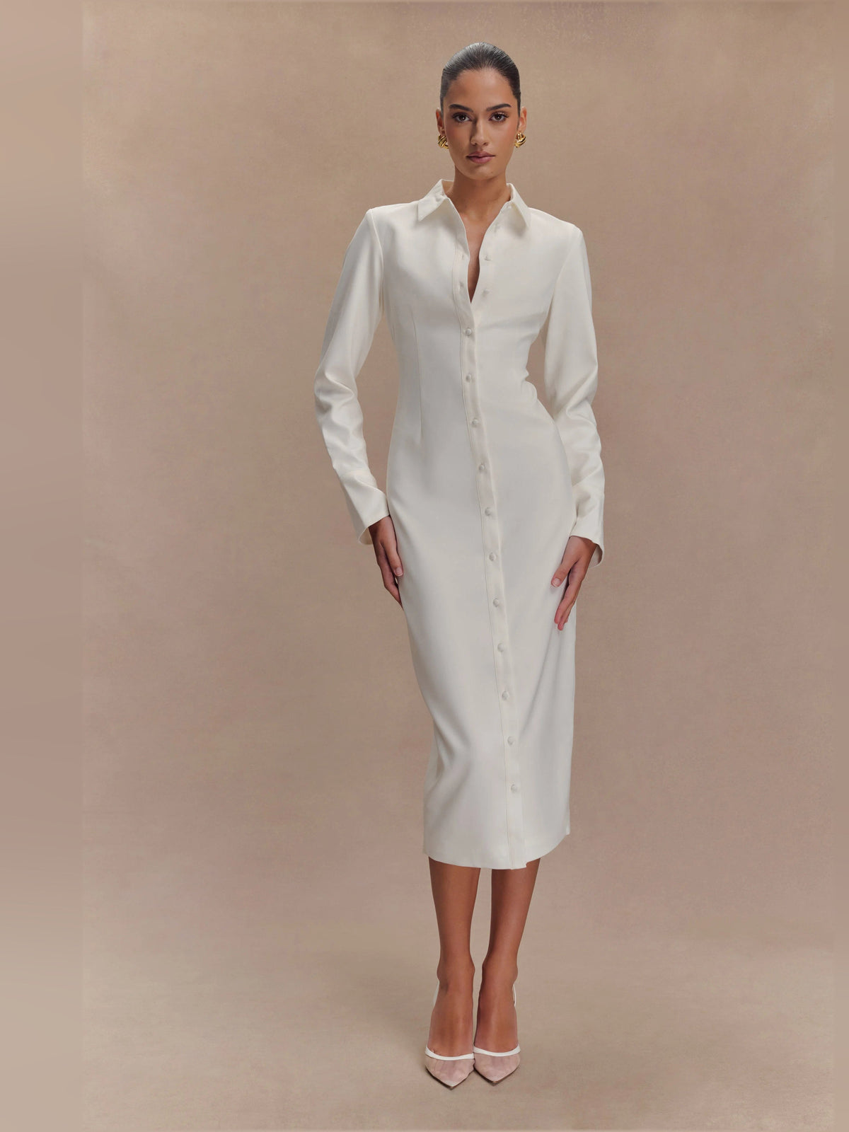 White fitted midi shirt dress with pointed collar and button front, long sleeves