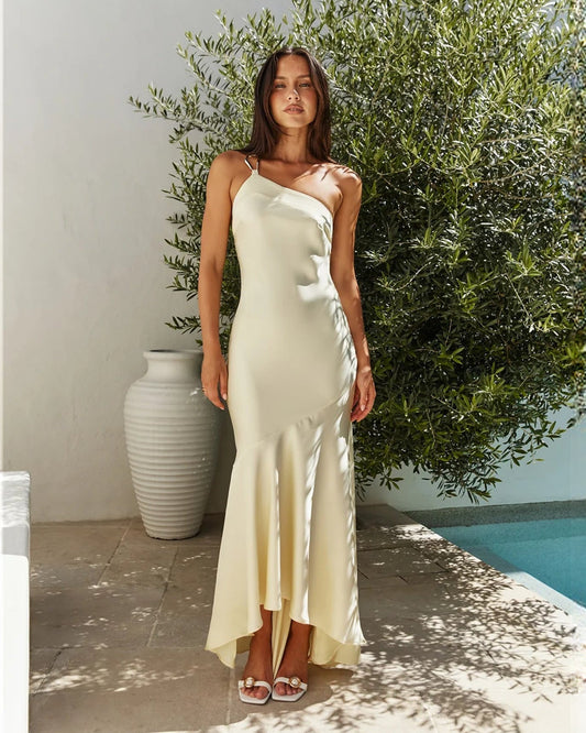One-shoulder satin A-line maxi bridesmaid dress in pale yellow, draped bodice and midi-slit hem