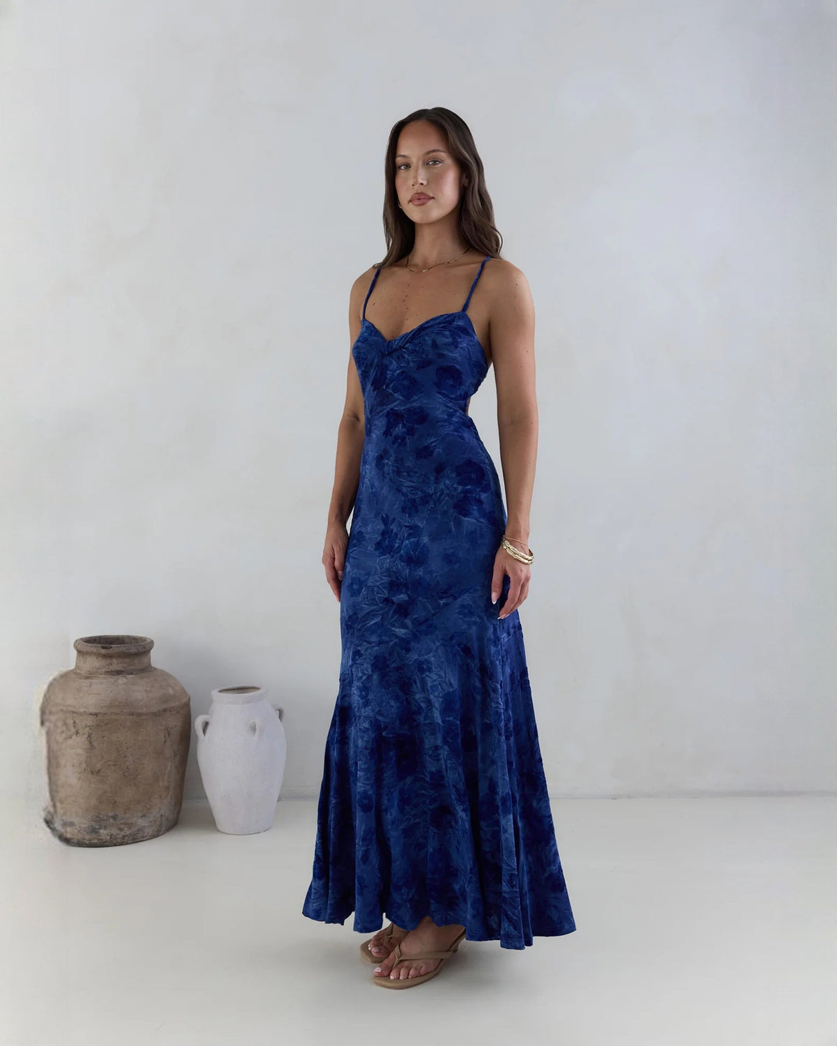 Navy sleeveless mesh maxi dress with spaghetti straps, sweetheart bodice, A-line skirt.
