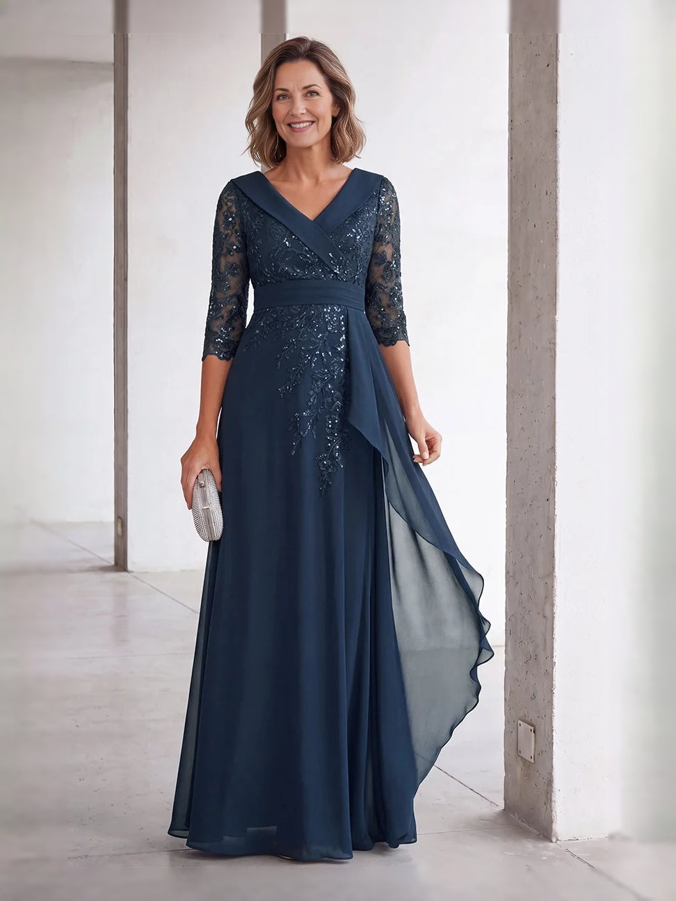 Dark blue sequin V-neck A-line gown with sheer 3/4 lace sleeves and draped chiffon overlay