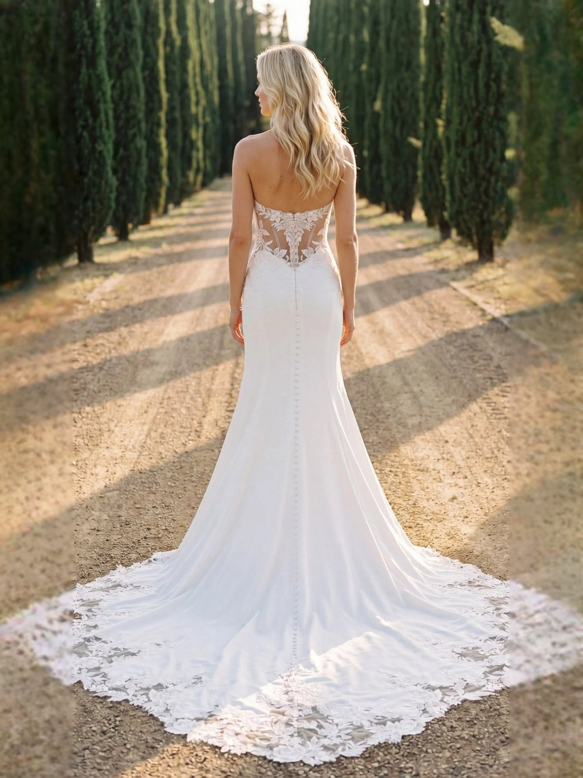 Ivory strapless mermaid wedding dress with lace corset back and long train