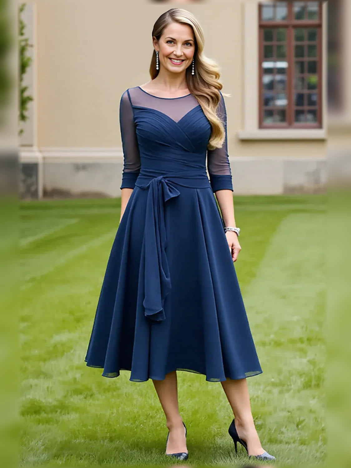 Navy A-line midi dress with illusion neckline, sheer sleeves, draped waist bow detail