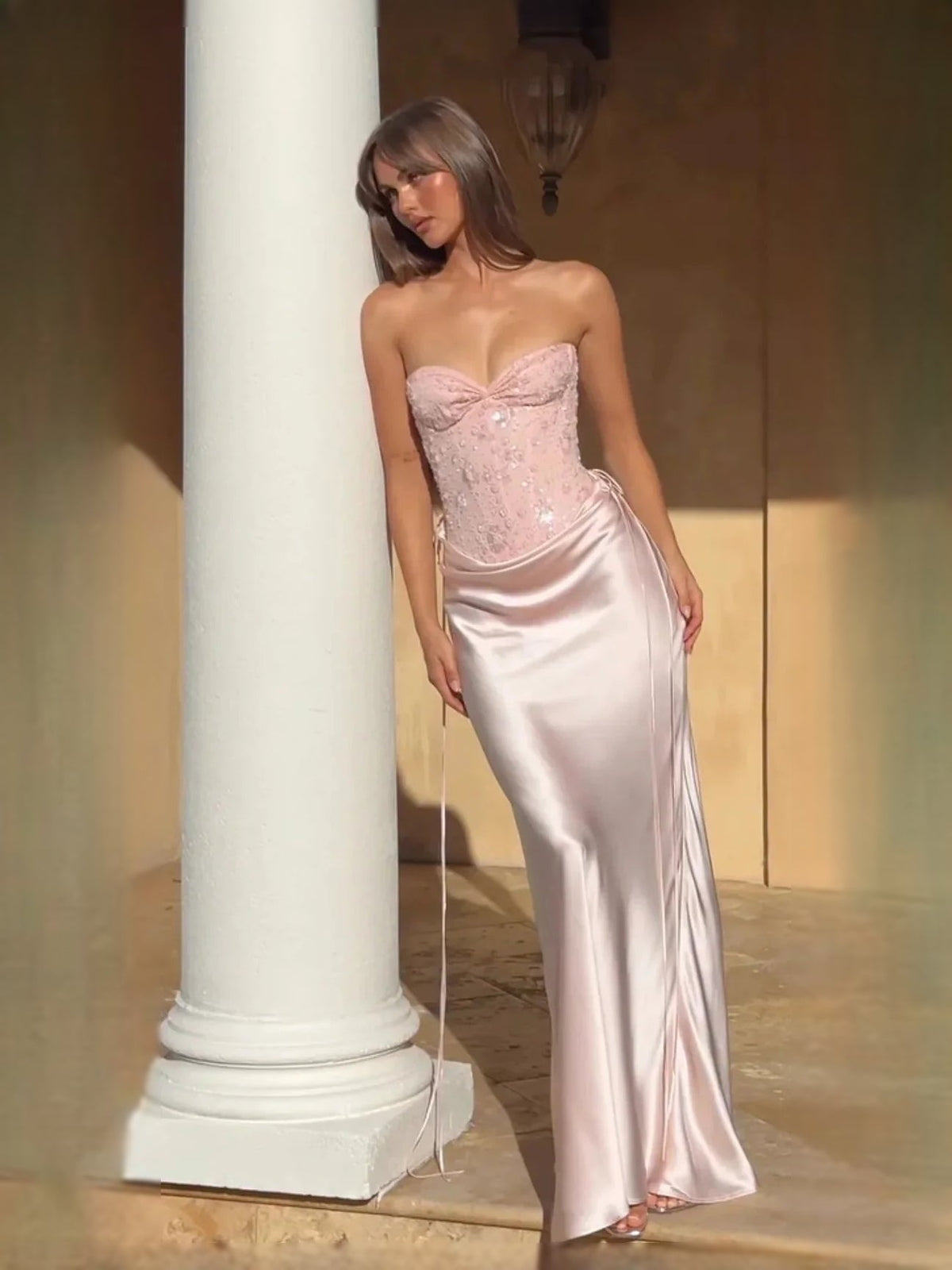 Light pink satin corset prom dress with sweetheart neckline, sequin bodice, mermaid hem