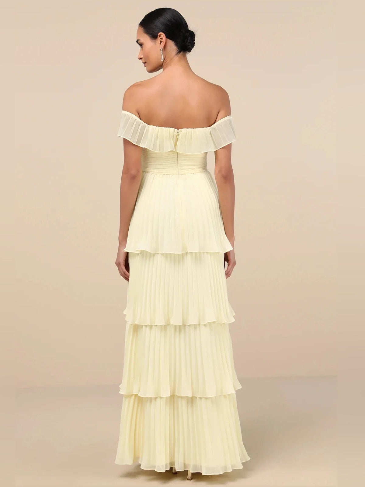 Off-shoulder tiered A-line maxi dress in pale yellow with ruffled bodice and sleeves