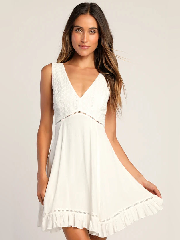 White embroidered mini dress, sleeveless V-neck with ruffled hem trim