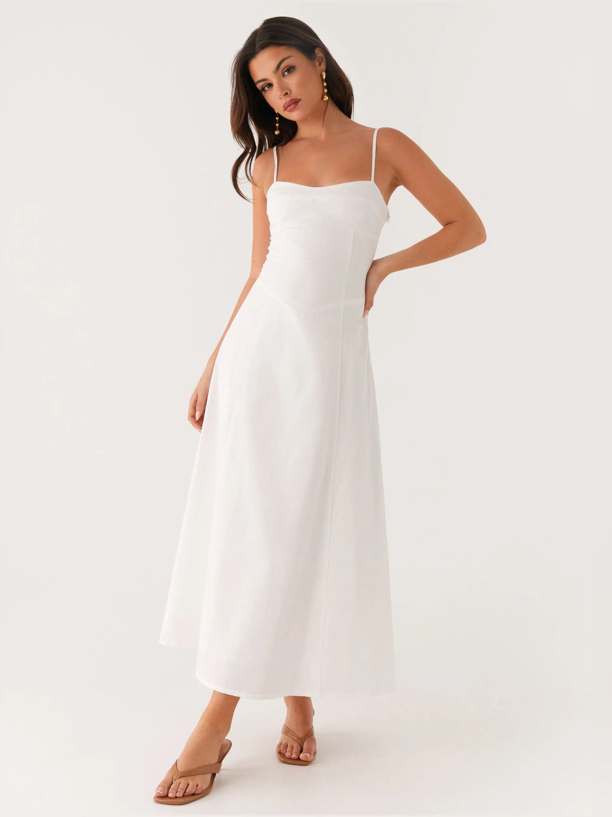 White midi formal dress with spaghetti straps, scoop neckline, fitted bodice, flared skirt
