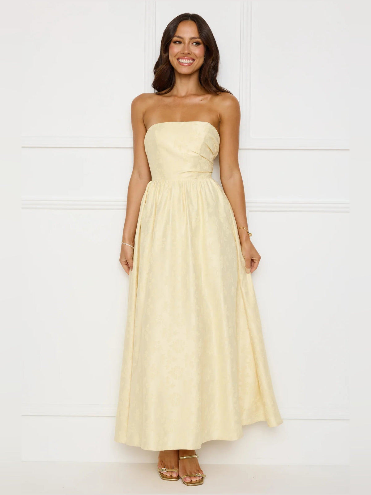Yellow a-line maxi formal dress with strapless neckline, full-length front view