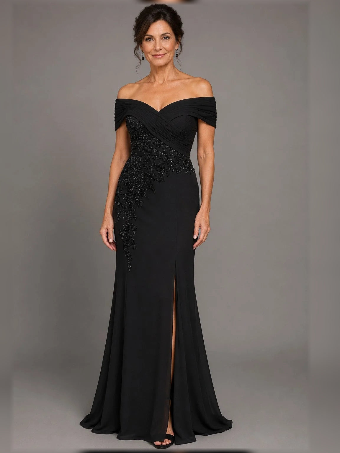 Black off-shoulder mermaid gown with ruched neckline, embellished bodice and side slit