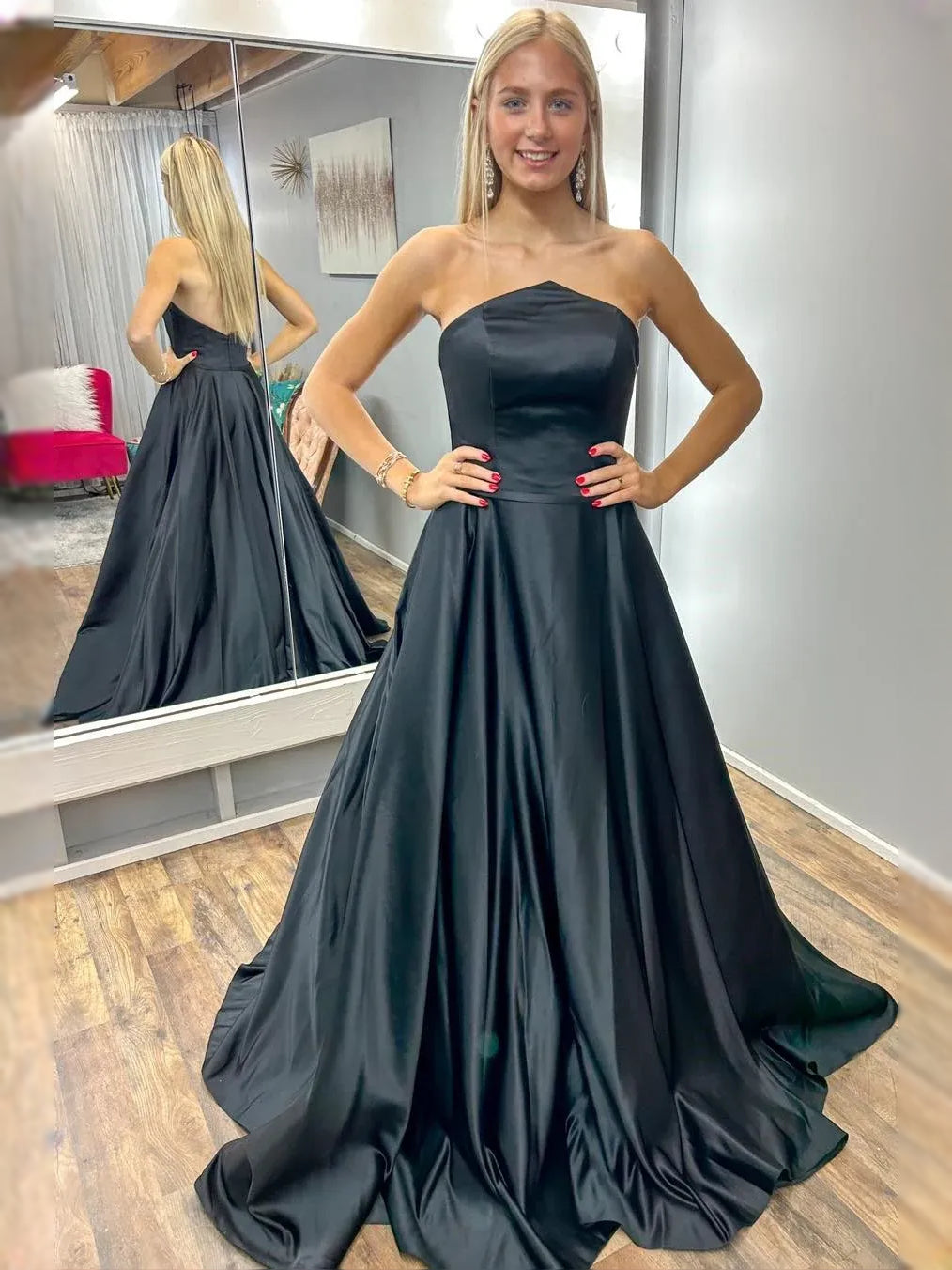 Black strapless sweetheart satin ball-gown maxi dress with fitted bodice and voluminous skirt