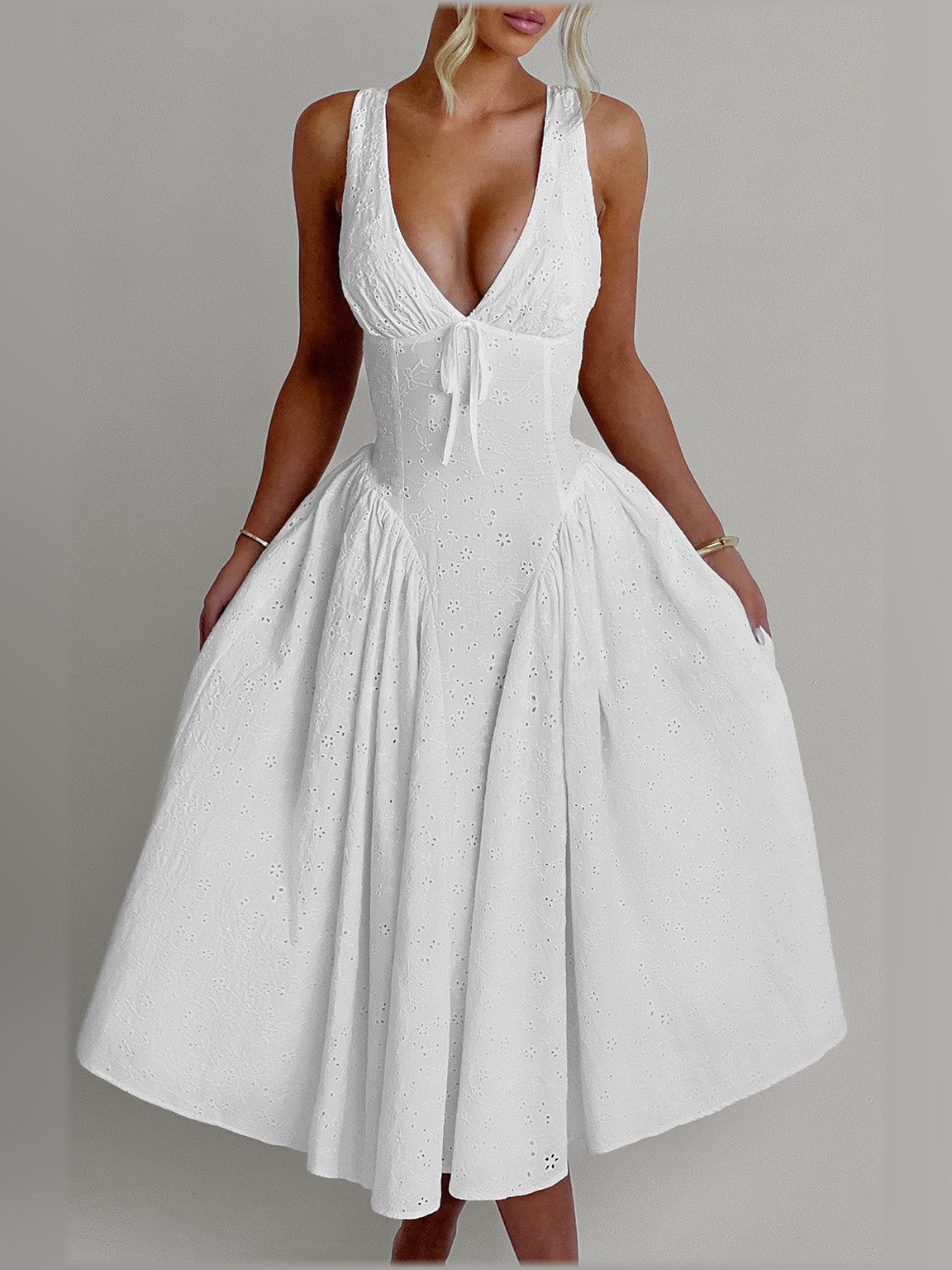 Ivory midi formal dress with deep V-neck, sleeveless bodice, and gathered full skirt