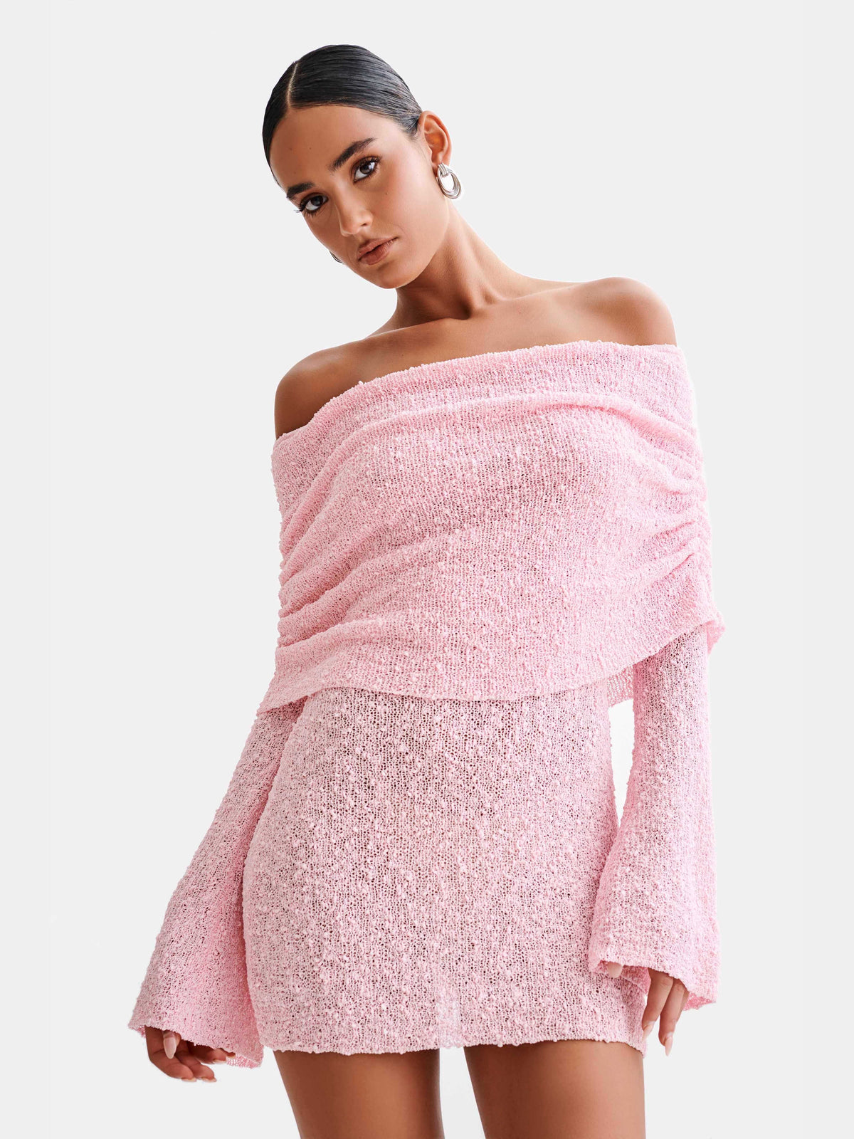 Baby pink off-shoulder mini homecoming dress with glitter texture and ruffled neckline