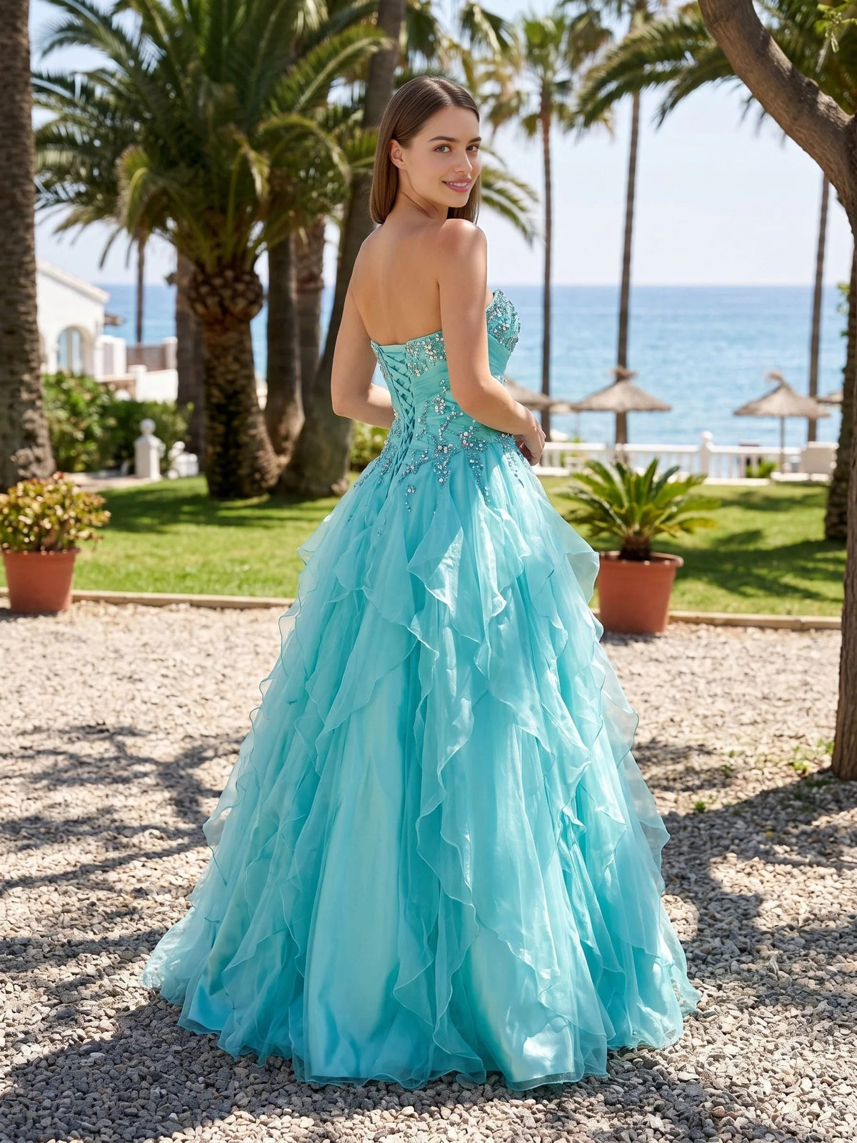 Turquoise corset ball gown with sweetheart neckline, layered ruffled tulle skirt