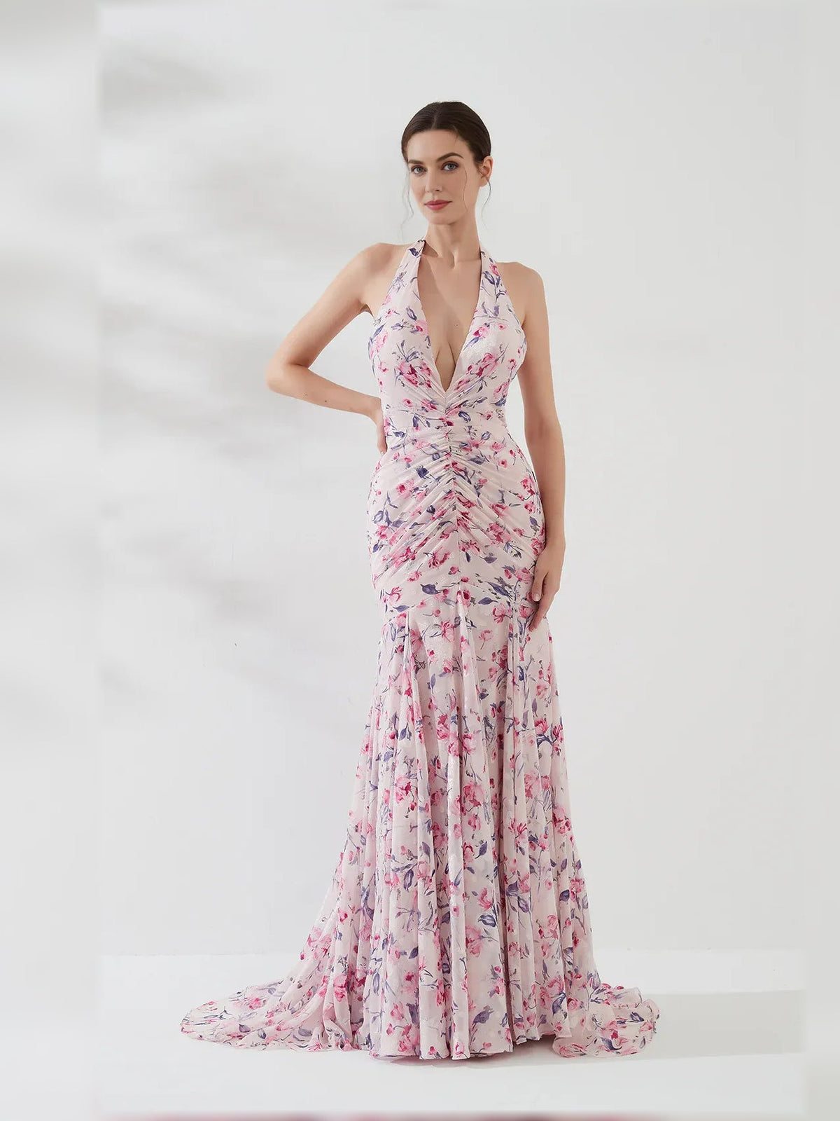 Floral halter gown with ruched bodice and layered floor-length skirt