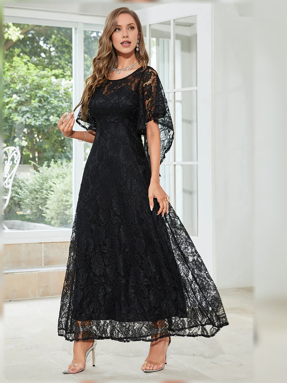 Black lace A-line formal dress with flutter sleeves and crew neckline, full-length skirt