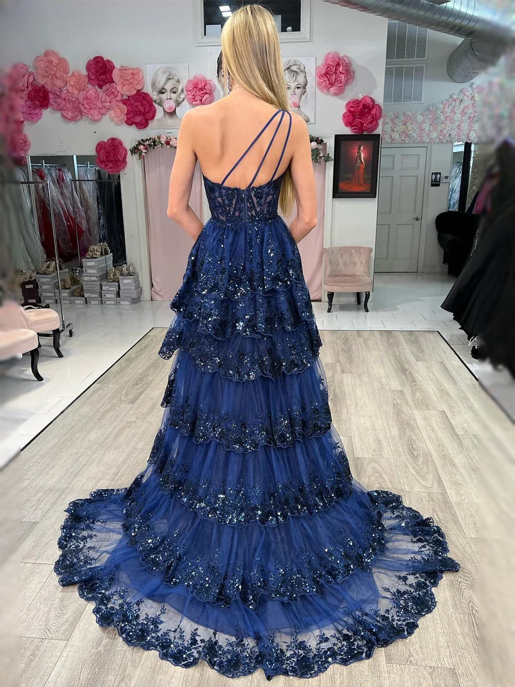 Dark navy one-shoulder corset-style maxi prom dress with tiered tulle skirt and slit