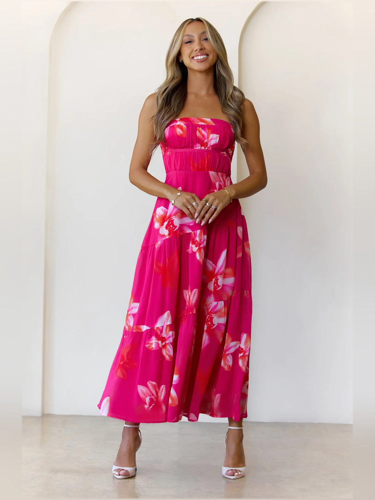 Pink a-line maxi formal dress with strapless neckline, full-length front view