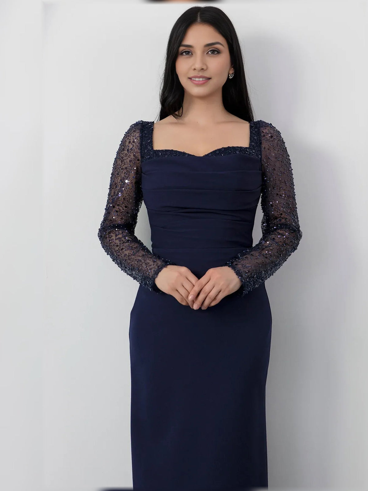 Navy blue square-neck formal dress with ruched bodice and sheer long sleeves